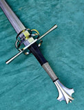 European hand and a half longsword with detailed hilt and grip on a green background.
