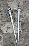 European hand and a half longsword displayed on a stone surface, showcasing its elegant design and craftsmanship.