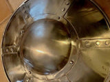 Hammered Steel Buckler Shield - 14 inch showing a polished metal surface and domed boss, ideal for medieval reenactments.