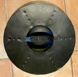 Hammered Steel Buckler Shield, 14 inch - Man At Arms, top view showing domed boss and handle.