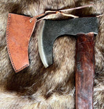 Short Viking Bearded Axe with leather edge cover on fur background