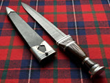 Scottish Long Dirk with Damascus Blade and ebony grip displayed on a traditional tartan background.