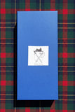 Hand carved antler Sgian Dubh beautifully presented in a blue gift box with emblem on tartan background.