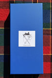 Hand carved deer antler Sgian Dubh display ready gift box featuring a shield emblem on blue packaging.