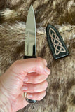 Hand carved deer antler Sgian Dubh display ready gift box in hand, showcasing traditional Scottish knife design.