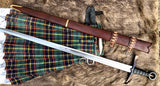 Kern Irish sword with scabbard and kilt on fur background, showcasing intricate craftsmanship.