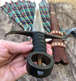 Kern Irish sword by Kingdom of Arms held in hand, showcasing the ring hilt and blade design.