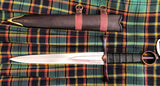 Irish Kern companion dagger displayed with sheath on a tartan background.