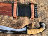 Iberian falcata sword featuring a curved blade and intricate leather handle details on a textured fur background.
