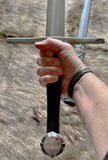 Hand forged Crecy sword held firmly with a detailed cross guard and round pommel.