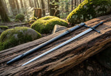 Late Crusader medieval sword displayed on a rustic wooden log in a forest setting surrounded by mossy rocks.