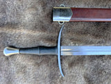 Close-up of the Wakefield knightly bastard sword with scabbard on fur background.