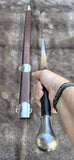 Close-up of the Wakefield knightly bastard sword held in hand, showcasing its craftsmanship and detailed hilt.
