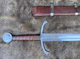 The Bedford Medieval War Sword with intricate design and leather grip, alongside its wooden sheath, showcased on a fur background.