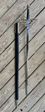 Renaissance rapier with scabbard displayed on wooden floor, showcasing 17th-century craftsmanship and ambidextrous design.