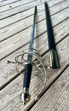 Ambidextrous Renaissance Rapier, 17th Century design with curved guard and double blades on wooden surface.