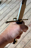Main Gauche Parrying Dagger held in hand, showcasing its blade and crossguard detail.