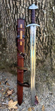 Troll's Bane Viking sword replica with leather scabbard, 9th century design and power runes detail.