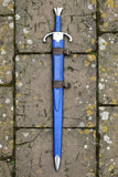 Blue arming sword with a sheath on a textured stone background
