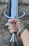 The Giornico Arming Sword held in a hand, showcasing the hilt and grip design.