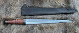 Irish Scian with a sleek blade and wooden handle, complete with a black leather sheath, resting on fur.