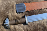 The Saxon Langsax or Long Seax with leather sheath displayed on fur background.